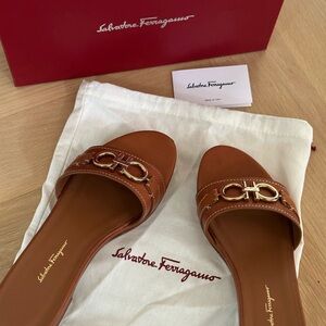 Salvatore Ferragamo classic saddle brown slides with gold.